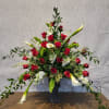 Stands approx 42" tall and full of lovely red roses adorned with
