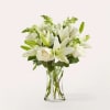 &ldquo;Radiate elegance and serenity with this graceful all-white floral arrangement. Featuring timeless