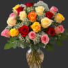A nice assortment of 24 mixed color roses in a glass vase