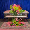 An multi colored garden: this standard size casket spray is pretty and