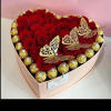 We will custom design a heart shaped centerpiece with roses and ferrero