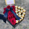 We will custom design a heart shaped centerpiece with roses and ferrero