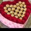 We will custom design a heart shaped centerpiece with roses and ferrero