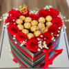 We will custom design a heart shaped centerpiece with roses and ferrero