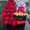 We will custom design a heart shaped centerpiece with roses and ferrero