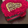 We will custom design a heart shaped centerpiece with roses and ferrero