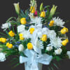 This is a beautiful standing funeral basket of flowers with yellow and
