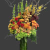 mix of flowers in a tall cylinder vase, cymbidium orchids, bells of