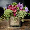This chic arrangement combines the elegance of burgundy cymbidium orchids, the airy