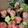 Delight in the romantic elegance of this hand-tied bouquet featuring pink spray