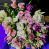 This breathtaking bouquet features soft pink roses paired with delicate lisianthus and