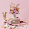 Birthday Flower Cake is made of fresh flower blooms and birthday candles