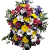 Introducing our vibrant easel spray, a stunning floral arrangement that captures the