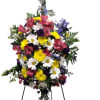 Introducing our vibrant easel spray, a stunning floral arrangement that captures the