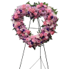 This exquisite floral arrangement features a vibrant open heart design, artfully crafted