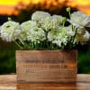 Experience timeless beauty with this charming arrangement of premium white ranunculus artistically