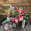 Elegant arrangement with different shades of pink, which includes some hydrangeas, lilies