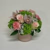 A soft and subtle mix of roses, hydrangea, baby&#039;s breath, carnations and