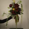 A bold and dramatic composition, The Burmese Cat bouquet blends deep crimson