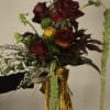 A bold and dramatic composition, The Burmese Cat bouquet blends deep crimson