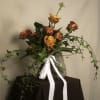 A bouquet of timeless elegance, featuring a dozen premium roses wrapped beautifully