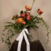 A bouquet of timeless elegance, featuring a dozen premium roses wrapped beautifully