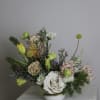 Fraser is a lush floral arrangement featuring a captivating mix of blooms