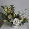 Fraser is a lush floral arrangement featuring a captivating mix of blooms