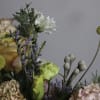 Fraser is a lush floral arrangement featuring a captivating mix of blooms