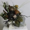 Thida is a captivating bouquet blending dried and preserved elements for a