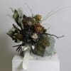Thida is a captivating bouquet blending dried and preserved elements for a