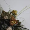Thida is a captivating bouquet blending dried and preserved elements for a
