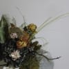 Thida is a captivating bouquet blending dried and preserved elements for a