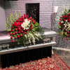 An rose colored garden: this standard size casket spray is pretty and