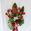 This arrangement consists of one dozens roses along with lilies and is