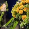 Roses and lilies harmoniously displayed together. Display designed to evoke a sense