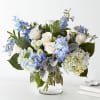 Let this uplifting arrangement be reminders of the clear skies ahead. Capturing