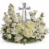 An elegant display of faith and divine peace, this beautiful arrangement will