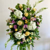Pay tribute to a loved one with a custom-designed standing spray. ****Please