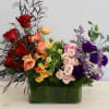 This luscious arrangement features all colors of the rainbow with seasonal flowers.