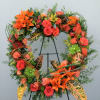 Shades of orange, peach, and greens designed on an open heart accented