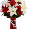 The Expressions of Love arrangement brings together roses and Asiatic lilies to