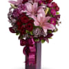True romance! Express your love with this gorgeous flower arrangement, bursting with