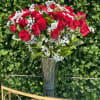 24 red roses in our cone vase with baby&rsquo;s breath , lush
