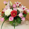 Comes with a variation of pink roses, matching gerbers, White hydrangeas in