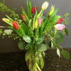 10 mixed tulips with nice greenery and filler flower