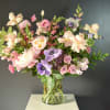 This gorgeous vase arrangement is ready to dazzle with an array of