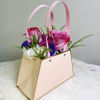A stunning bouquet purse that embodies elegance, grace, and the celebration of
