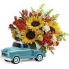 Beep beep! Lovely colorful bouquet of spray roses and sunflowers riding in