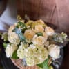 White roses, Hydrangeas, Eucalyptus, and Wax Flower Designed for a Simply Elegant